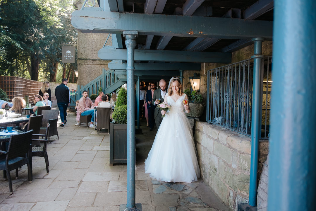 Bride arriving at the saxon mill for her wedding reception
