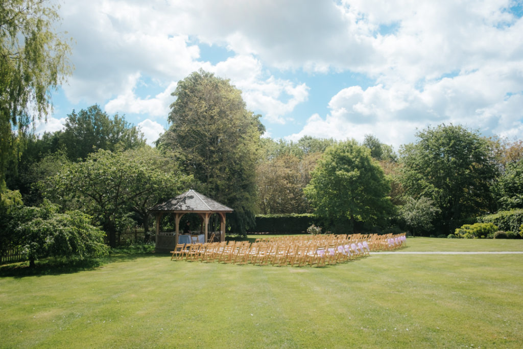 Worton Hall "green" and Pagoda ready and seating laid out for a wedding ceremony