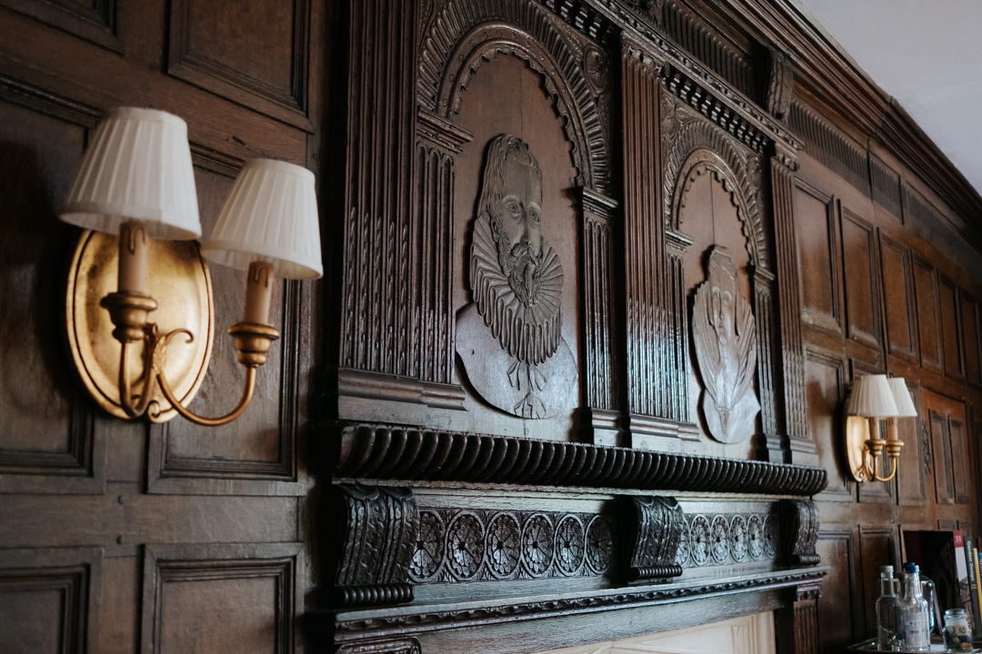 Carved oak pannelled walls in bridal suite at Gravetye Manor